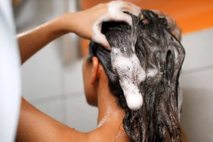woman wash her dark hair