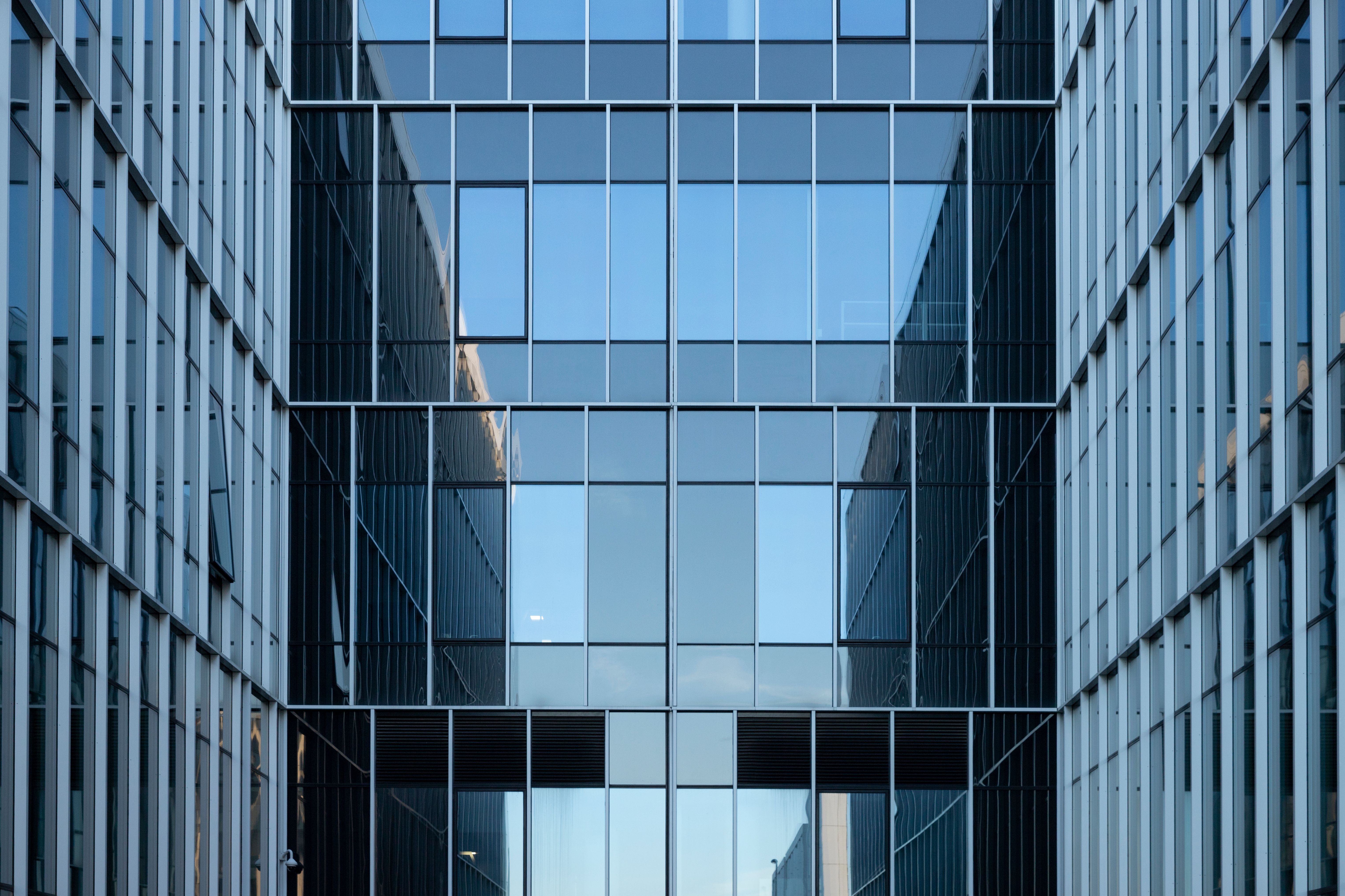 Contemporary office building facade with reflective glass windows