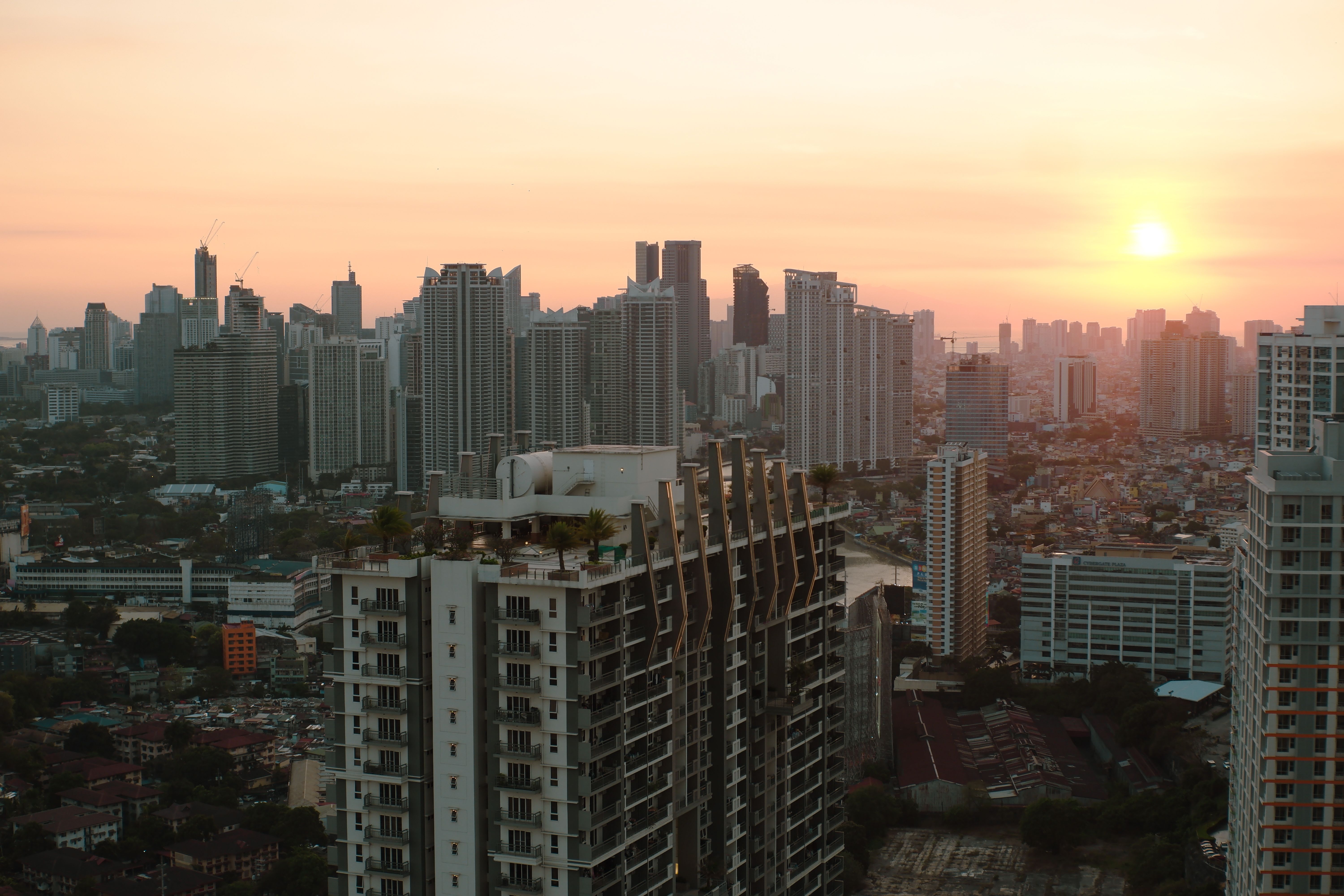 Taguig City skyline at sunset, representing the Serra Residences’ connectivity to the wider city.